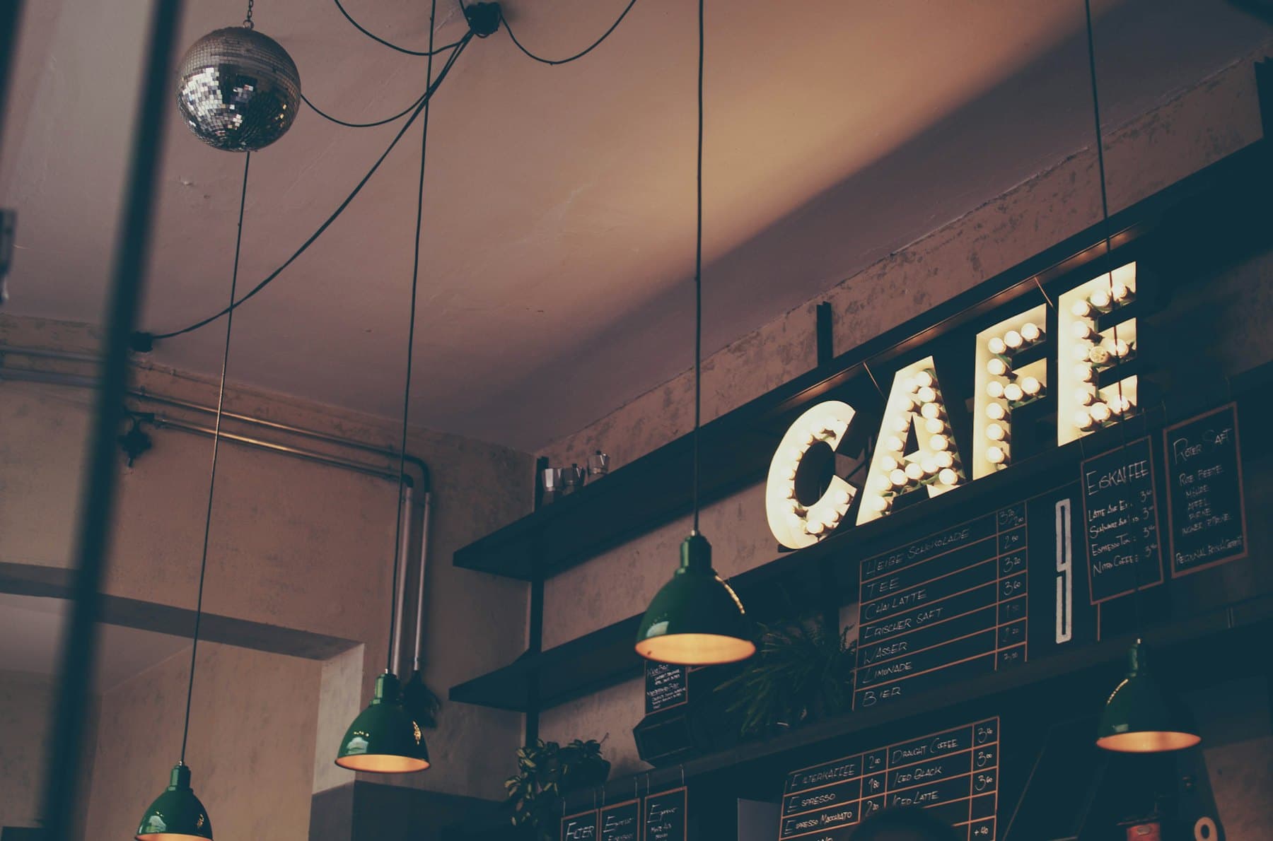 Sunlit Wildwood Coffee interior with timber tables and a warm morning glow
