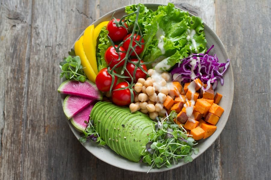 A fresh grain bowl with vegetables on a wooden table